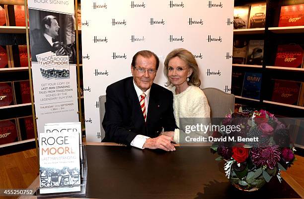 Roger Moore signs copies of his new book "Last Man Standing: Tales from Tinseltown" alongside wife Kristina Tholstrup at Harrods Bookshop on...