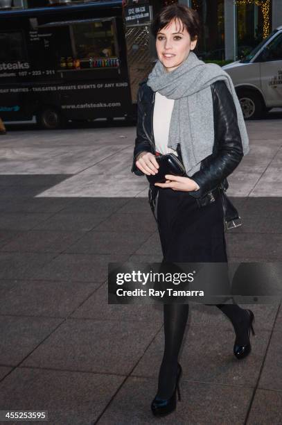 Actress Felicity Jones enters the Sirius XM Studios on December 11, 2013 in New York City.