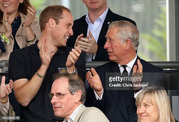 Prince William, Duke of Cambridge and Prince Charles, Prince of Wales watch the athletes during the Invictus Games athletics at Lee Valley on...