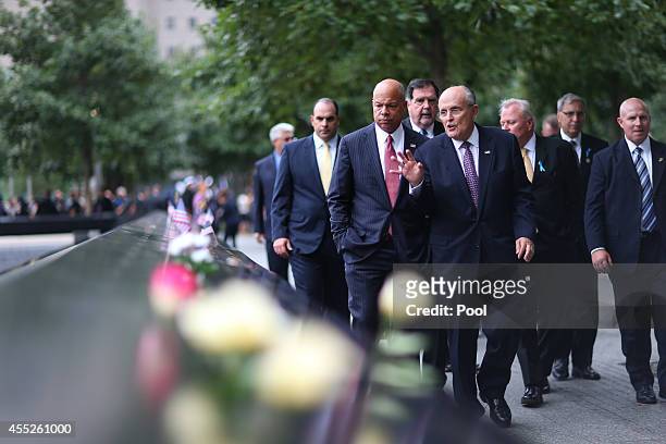 Department of Homeland Security Secretary Jeh Johnson and Former New York City Mayor Rudy Giuliani visit the South Tower Refecting Pool during...