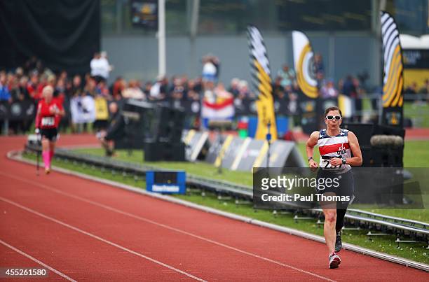 Patricia Collins of the United States leads from Marianne Huche of Denmark in the 1500m Women Ambulant IT1 final during day 1 of the Invictus Games,...