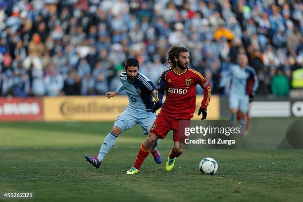 Kyle Beckerman of Real Salt Lake controls the ball during the MLS Cup Final against the Paulo Nagamura of Sporting Kansas City at Sporting Park on...