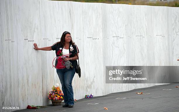 Family member touches the name of Mark Bingham during the 13th anniversary ceremonies commemorating the September 11th attacks at the Wall of Names...