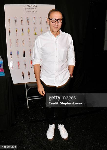 Designer Gilles Mendel poses backstage at the J.Mendel fashion show during Mercedes-Benz Fashion Week Spring 2015 at The Theatre at Lincoln Center on...