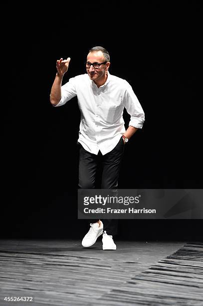 Designer Gilles Mendel walks the runway at the J.Mendel fashion show during Mercedes-Benz Fashion Week Spring 2015 at The Theatre at Lincoln Center...