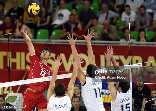 Iran's Mojtaba Mirzajanpour attacks during the FIVB World Championships match between Argentina and Iran on September 11, 2014 in Bydgoszcz, Poland.