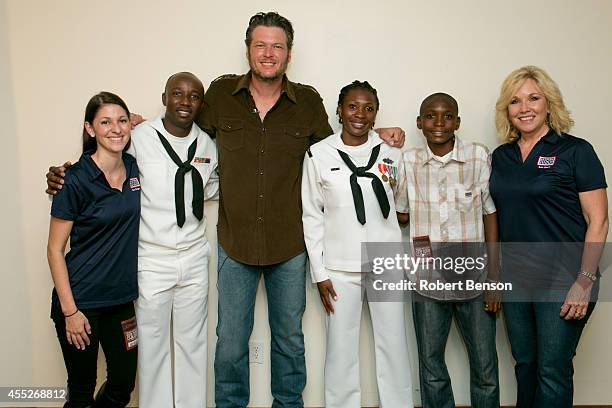 Blake Shelton meets with a military USO family, Roland Kiendrebeogo, Marie Esther Kiendrebeogo and their son Oswald Kiendrebeogo and Judy Forrester ,...