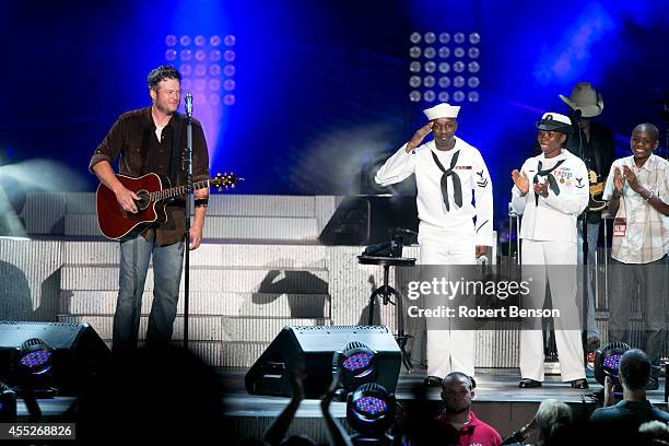 Blake Shelton and JCPenney honor a military USO family, Roland Kiendrebeogo, his wife Marie Esther Kiendrebeogo and their son Oswald Kiendrebeogo ,...