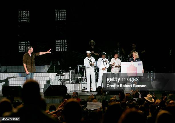 Blake Shelton and JCPenney honor a military USO family, Roland Kiendrebeogo, his wife Marie Esther Kiendrebeogo and their son Oswald Kiendrebeogo ,...