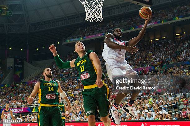 Kenneth Faried of the USA Basketball Men's National Team shoots against Donatas Motiejunas of the Lithuania Basketball Men's National Team during a...