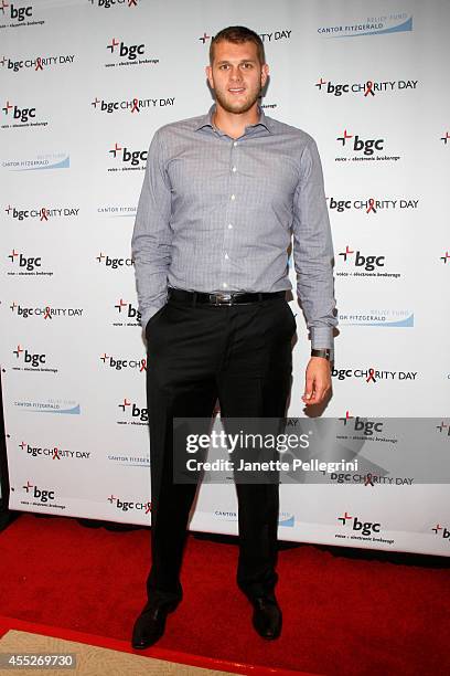 Basketball player Cole Aldrich attends Annual Charity Day Hosted By Cantor Fitzgerald And BGC at BGC Partners, INC on September 11, 2014 in New York...