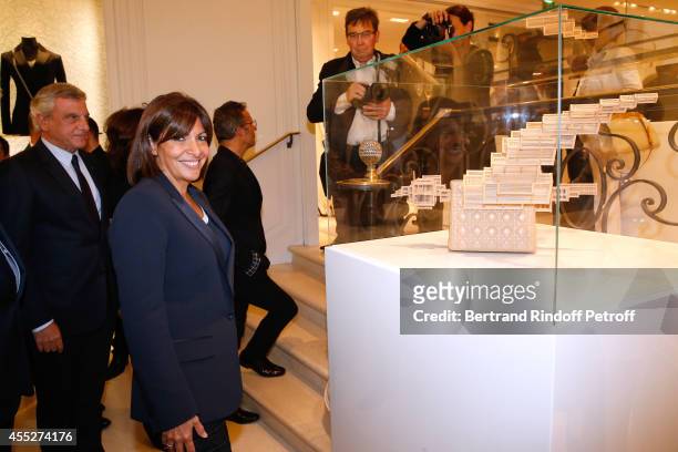 Jean Claude Cathalan and Mayor of Paris Anne Hidalgo pose near work from Kum Chi Keung, Lady bird during the "Promenade pour un objet d'exception"....