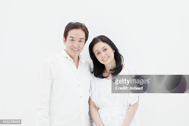 a close middle-aged couple - the japanese wife foto e immagini stock