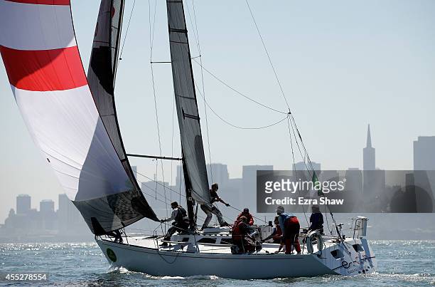 Sailors on Elan in the Express 37 class take down their spinaker during the Rolex Big Boat Series on September 11, 2014 in San Francisco, California.