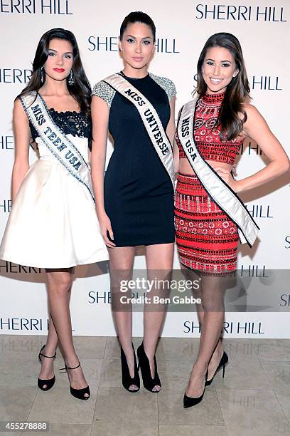 Miss Teen USA K. Lee Graham, Miss Universe Gabriela Isler and Miss USA Nina Sanchez attend the Sherri Hill Fashion Show during Mercedes-Benz Fashion...