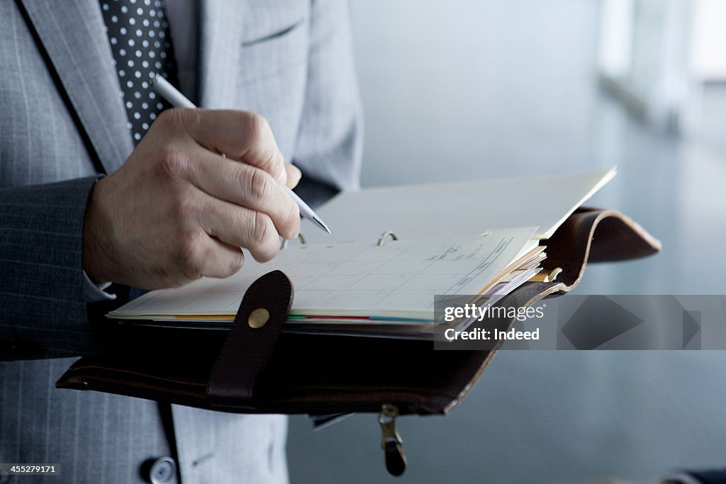 BUSINESS SCENE Hand of taking a memo