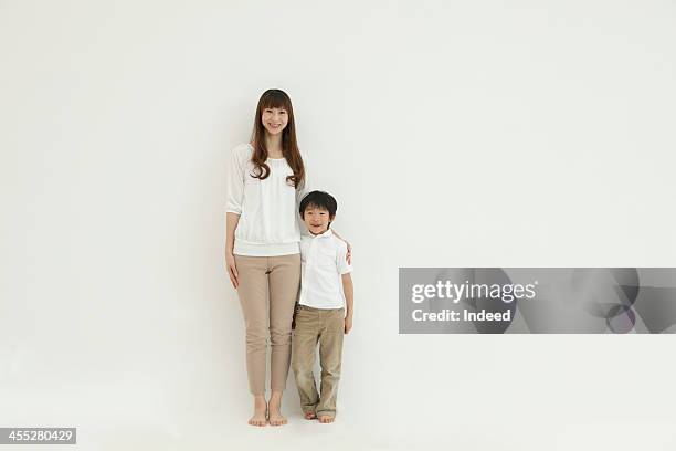 mother and son smile in front of the white background - purity stock pictures, royalty-free photos & images