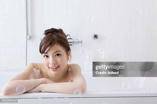 woman takes a bath - japanese women bath stock-fotos und bilder