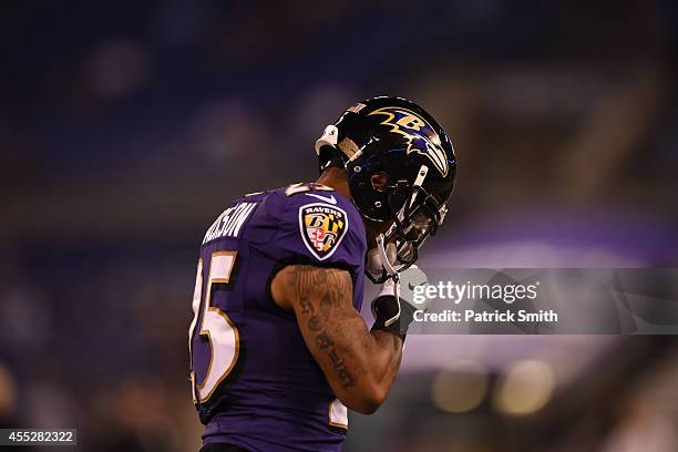 Cornerback Asa Jackson of the Baltimore Ravens warms up against the Pittsburgh Steelers at M&T Bank Stadium on September 11, 2014 in Baltimore,...