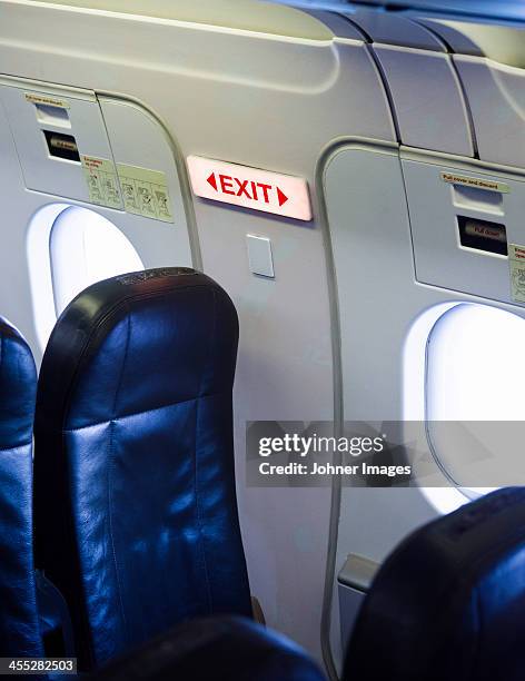 exit sign in airplane - 非常口 ストックフォトと画像