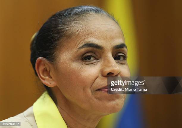Marina Silva, presidential candidate of the Brazilian Socialist Party, smiles at a press conference before a campaign event at the Engineering Club...