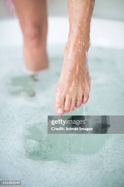 womans feet in bath - toe stock pictures, royalty-free photos & images
