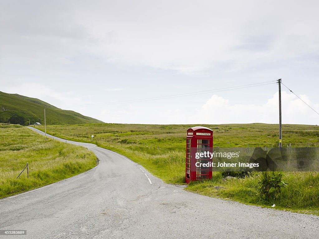 Telephone booth on side of country road