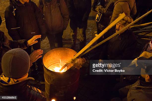 Protesters warming up themselves on Maidan Square on December 11, 2013 in Kiev, Ukraine. Thousands have been protesting against the Ukrainian...