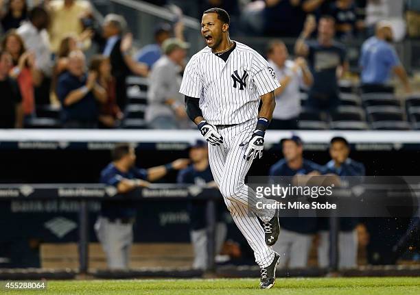 Chris Young of the New York Yankees celebrates after hitting a walk-off game winning three run home run against the Tampa Bay Rays in the bottom of...
