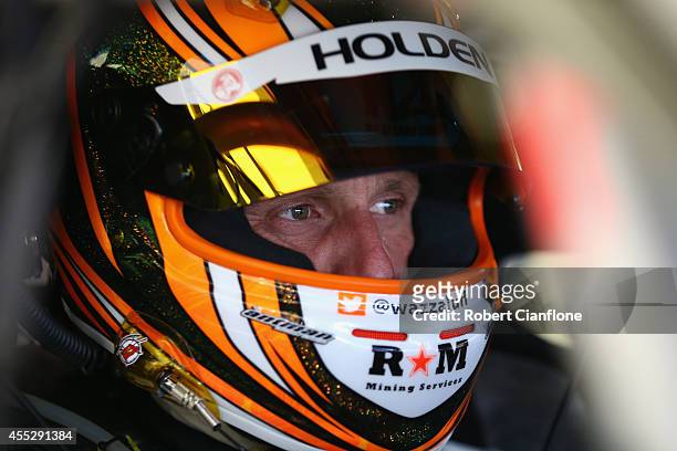 Warren Luff driver of the Holden Racing Team Holden sits in his car prior to practice ahead of the Sandown 500, which is round ten of the V8 Supercar...