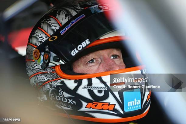 Greg Murphy driver of the Holden Racing Team Holden sits in his car prior to practice ahead of the Sandown 500, which is round ten of the V8 Supercar...