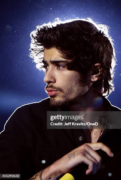 Singer Zayn Malik of One Direction performs onstage during the One Direction" Where We Are" Tour at Rose Bowl on September 11, 2014 in Pasadena,...