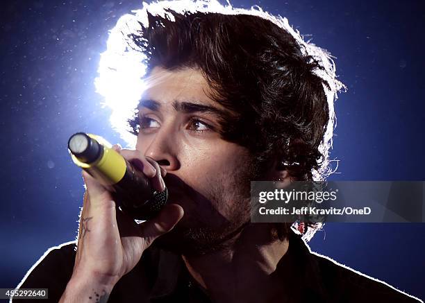 Singer Zayn Malik of One Direction performs onstage during the One Direction" Where We Are" Tour at Rose Bowl on September 11, 2014 in Pasadena,...