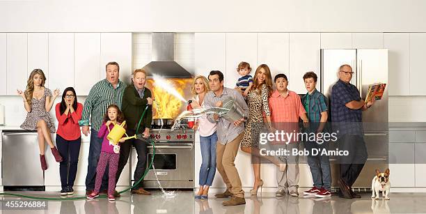 Walt Disney Television via Getty Images's "Modern Family" stars Sarah Hyland as Haley, Ariel Winter as Alex, Eric Stonestreet as Cameron, Aubrey...