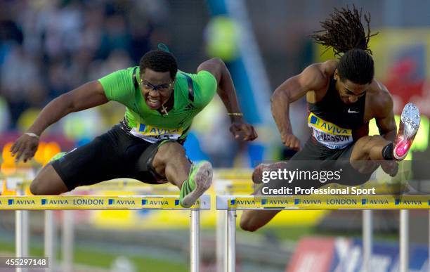 Dayron Robles of Cuba and Jason Richardson of the United States of America compete in the Mens 110m Hurdles during the Aviva London Grand Prix at...