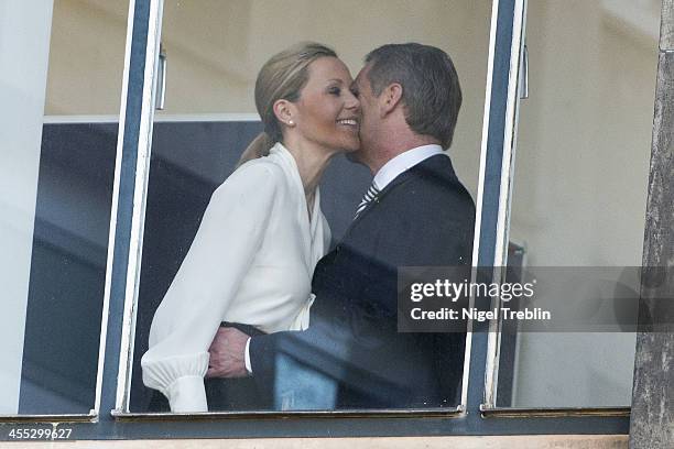 Former German First Lady Bettina Wulff and her estranged husband, former German President Christian Wulff, welcome each other at the Landgericht...