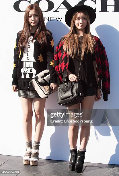 Son Na-Eun and Yun Bo-Mi of A pink pose for photographs during the COACH pop-up store opening event at the Galleria on September 5, 2014 in Seoul,...