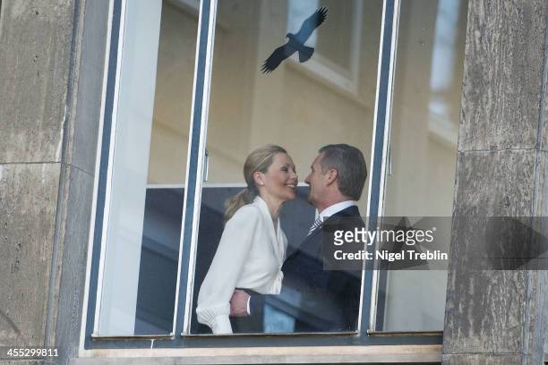 Former German First Lady Bettina Wulff and her estranged husband, former German President Christian Wulff, welcome each other at the Landgericht...