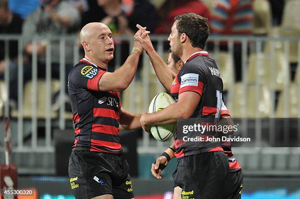 Tom Taylor celebrates his try with Willi Heinz of Canterbury of Wellington during the round five ITM Cup match between Canterbury and Wellington at...