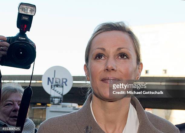 Former German First Lady Bettina Wulff arrives at the Landgericht Hannover courthouse to testify in the case of her estranged husband, former German...
