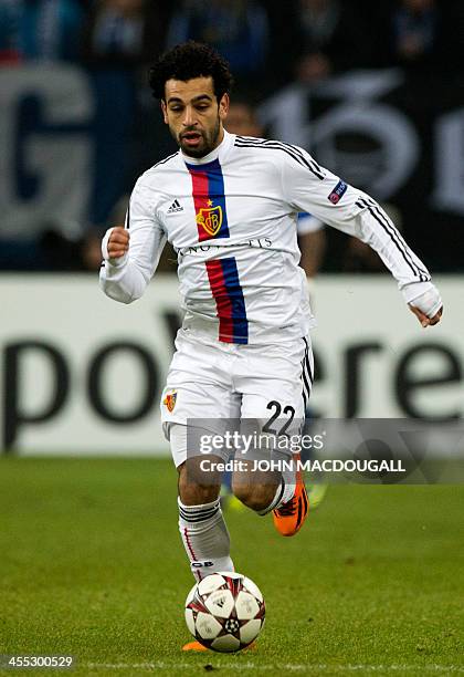 Basel's Egyptian midfielder Mohamed Salah runs with the ball during the UEFA Champions League group E football match FC Schalke 04 vs FC Basel 1893...