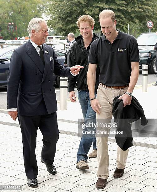 Prince William, Duke of Cambridge his brother Prince Harry and their father Prince Charles, Prince of Wales arrive for the athletes during the...