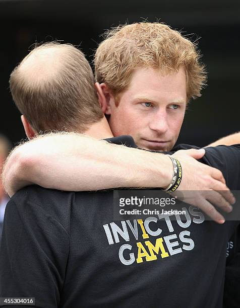 Prince William, Duke of Cambridge and his brother Prince Harry hug as the Duke leaves during the Invictus Games athletics at Lee Valley on September...