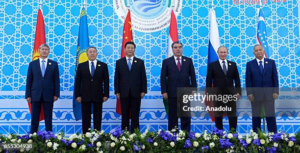 Leaders of the Shanghai Cooperation Organization , Tajik President Emomali Rahmon , Russian President Vladimir Putin , Chinese President Xi Jinping ,...