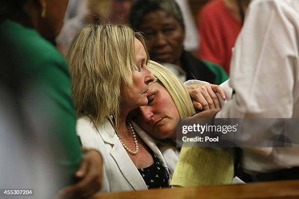 Oscar Pistorius takes his seat during his trial at the Pretoria High Court on September 12 in Pretoria, South Africa. South African Judge Thokosile...
