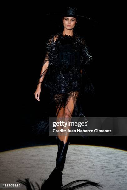 Model showcases designs by Roberto Verino on the runway at the Roberto Verino show during Mercedes Benz Fashion Week Madrid Spring/Summer 2015 at...