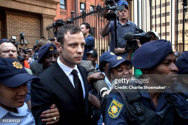Oscar Pistorius leaves on bail from the North Gauteng High Court on September 12, 2014 in Pretoria, South Africa. South African Judge Thokosile...