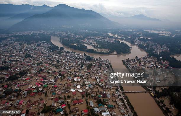 Aerial view of submerged residential houses in a flooded area on September 12, 2014 in Srinagar, the summer capital of Indian administered Kashmir,...