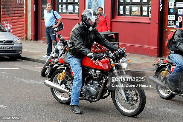 General view of a rider as he leaves the Royal Enfield store for a motorcycle ride to the Goodwood Revival to celebrate the unveiling of their new...