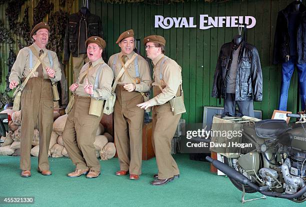 General view of performers at the Goodwood Revival after a motorcycle ride from the Royal Enfield store in London, to celebrate the unveiling of...